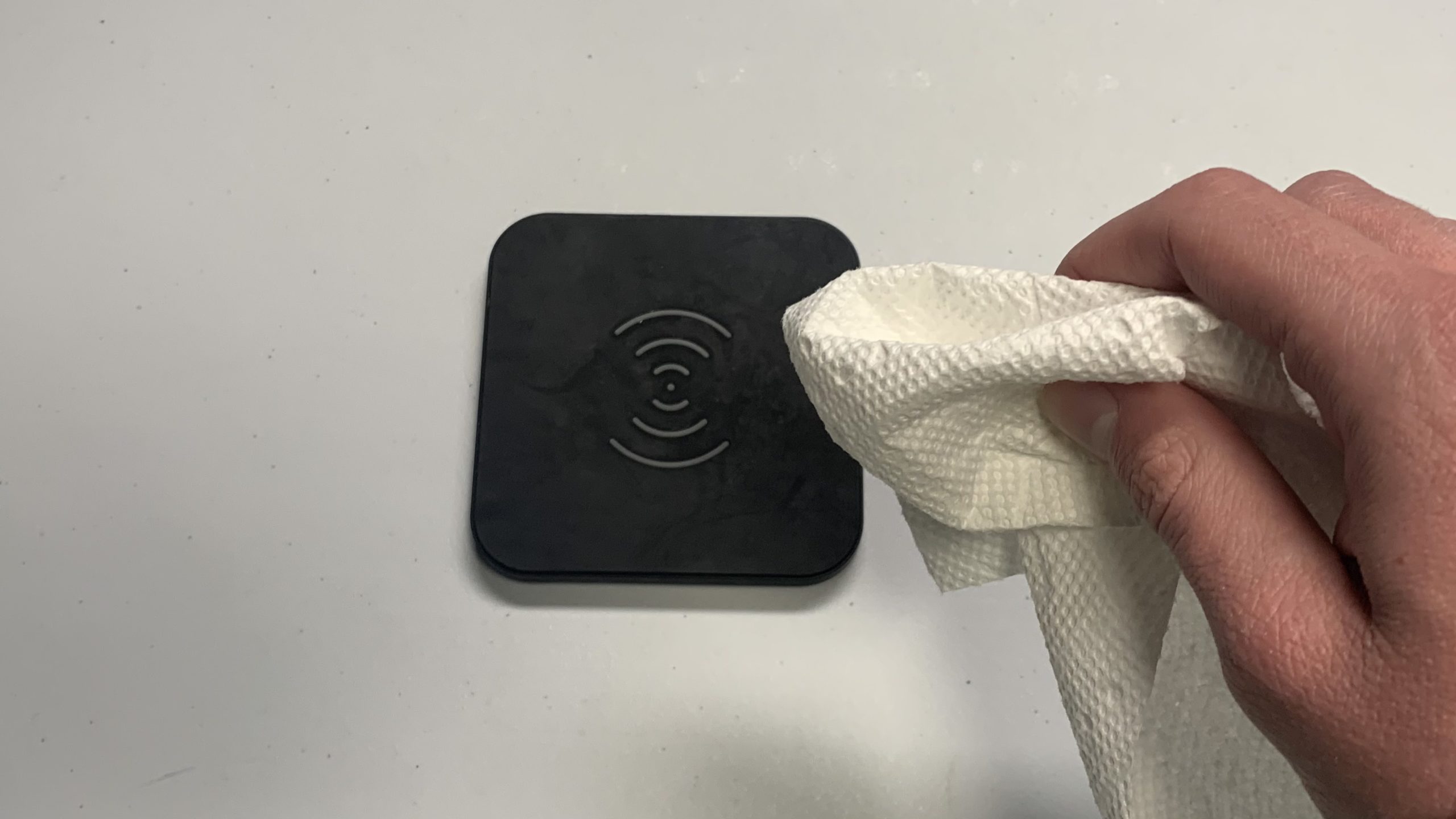 Wipe down wireless charger with paper towel